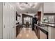 Modern kitchen with dark wood cabinets and stainless steel appliances at 1350 W Seascape Dr, Gilbert, AZ 85233
