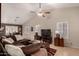 Open living space with a comfortable sectional sofa and hardwood floors at 1350 W Seascape Dr, Gilbert, AZ 85233