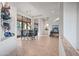 Open dining room with glass table and chairs near kitchen at 148 N La Barge Rd, Apache Junction, AZ 85119