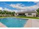 Backyard oasis with a sparkling pool and fountain at 14918 W Escondido Dr, Litchfield Park, AZ 85340