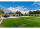 Relaxing backyard with a pool and seating area at 14918 W Escondido Dr, Litchfield Park, AZ 85340