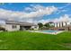 Backyard with a pool and home view at 14918 W Escondido Dr, Litchfield Park, AZ 85340