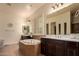 Elegant bathroom with double vanity and soaking tub at 14918 W Escondido Dr, Litchfield Park, AZ 85340