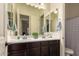 Clean bathroom with double sinks, a shower, and a toilet at 14918 W Escondido Dr, Litchfield Park, AZ 85340