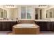 Bathroom with double vanity and a large soaking tub at 14918 W Escondido Dr, Litchfield Park, AZ 85340