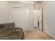Bedroom with a double bed and closet, leading to a bathroom at 14918 W Escondido Dr, Litchfield Park, AZ 85340