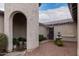 Front courtyard with fountain and mature plantings at 14918 W Escondido Dr, Litchfield Park, AZ 85340