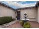 Front courtyard with fountain and mature plantings at 14918 W Escondido Dr, Litchfield Park, AZ 85340
