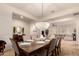 Bright dining room with a crystal chandelier and hardwood floors at 14918 W Escondido Dr, Litchfield Park, AZ 85340
