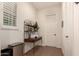 A hallway with a wooden shelf and a printer at 14918 W Escondido Dr, Litchfield Park, AZ 85340