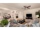 Open concept living area with seating and views into the dining room at 14918 W Escondido Dr, Litchfield Park, AZ 85340