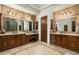 Luxurious bathroom with double vanities, a large shower, and rich wood cabinets at 15402 E Crested Butte Trl, Fountain Hills, AZ 85268
