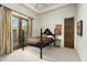 Bright bedroom with a comfortable bed and access to a patio at 15402 E Crested Butte Trl, Fountain Hills, AZ 85268