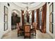 Elegant dining room with a large table, ornate chandelier, and rich decor at 15402 E Crested Butte Trl, Fountain Hills, AZ 85268
