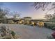 Stunning luxury home with stone accents and a circular driveway at 15402 E Crested Butte Trl, Fountain Hills, AZ 85268
