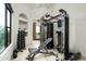 Well-equipped home gym with various exercise machines and free weights at 15402 E Crested Butte Trl, Fountain Hills, AZ 85268