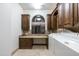 Bright laundry room with built-in cabinetry, workspace, and washer/dryer at 15402 E Crested Butte Trl, Fountain Hills, AZ 85268