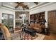 Cozy library features a fireplace, built-in bookshelves, and comfortable seating at 15402 E Crested Butte Trl, Fountain Hills, AZ 85268