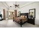 Large main bedroom with a king-size bed, fireplace, and access to a private balcony at 15402 E Crested Butte Trl, Fountain Hills, AZ 85268
