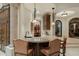Custom wet bar with granite countertop and leather barstools at 15402 E Crested Butte Trl, Fountain Hills, AZ 85268