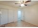 Bedroom with double door closet and access to bathroom at 1643 E Bishop Dr, Casa Grande, AZ 85122
