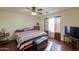 Spacious bedroom with large bed, TV, and ceiling fan at 1643 E Bishop Dr, Casa Grande, AZ 85122