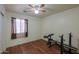 Bedroom with ceiling fan, wood-look flooring, and window at 1643 E Bishop Dr, Casa Grande, AZ 85122
