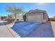 House exterior featuring a two-car garage and a paved driveway at 1643 E Bishop Dr, Casa Grande, AZ 85122