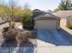 Single-story house with two-car garage and desert landscaping at 1643 E Bishop Dr, Casa Grande, AZ 85122