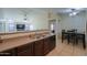 Kitchen with breakfast bar, opens to dining area and Gathering room at 1643 E Bishop Dr, Casa Grande, AZ 85122