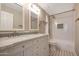 Updated bathroom with double vanity, marble countertop, and shower/tub at 1656 E Montoya Ln, Phoenix, AZ 85024