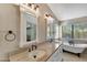 Elegant bathroom with double vanity, soaking tub, and walk-in shower at 1656 E Montoya Ln, Phoenix, AZ 85024