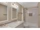 Bathroom boasts double vanity, marble countertop, and a shower/tub combo at 1656 E Montoya Ln, Phoenix, AZ 85024