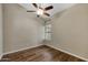 Bright bedroom with hardwood floors and a window with blinds at 1656 E Montoya Ln, Phoenix, AZ 85024