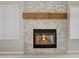 Stone fireplace with a wood mantel at 1656 E Montoya Ln, Phoenix, AZ 85024