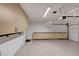 Organized garage with overhead storage and built-in cabinets at 1656 E Montoya Ln, Phoenix, AZ 85024