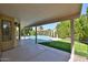 Covered patio featuring view of pool and green grass area; perfect for outdoor living and relaxation at 1656 E Montoya Ln, Phoenix, AZ 85024
