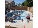 Work in progress: Pool undergoing resurfacing with workers on site at 1656 E Montoya Ln, Phoenix, AZ 85024