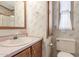 Bathroom with floral wallpaper, shower and toilet at 17200 W Bell Rd # 439, Surprise, AZ 85374