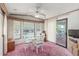 Dining room with glass table and chairs, access to patio at 17200 W Bell Rd # 439, Surprise, AZ 85374