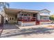 Single-wide mobile home with covered patio and carport at 17200 W Bell Rd # 439, Surprise, AZ 85374