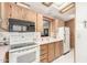 View of kitchen with stove, microwave and refrigerator at 17200 W Bell Rd # 439, Surprise, AZ 85374