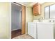 Laundry room with washer, dryer and cabinets at 17200 W Bell Rd # 439, Surprise, AZ 85374