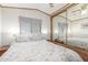 Main bedroom with mirrored closet and floral bedding at 17200 W Bell Rd # 439, Surprise, AZ 85374