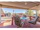 Covered patio with table and chairs, overlooking community at 17200 W Bell Rd # 439, Surprise, AZ 85374