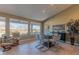 Bright dining area with large windows and seating for six at 18031 N Timber Ridge Dr, Surprise, AZ 85374