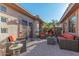 Relaxing patio with wicker furniture and a stone water feature at 18031 N Timber Ridge Dr, Surprise, AZ 85374