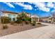 Charming house with neat landscaping and a two-car garage. Part of a neighborhood at 18346 W Coolidge St, Goodyear, AZ 85395