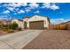 Beautiful one-story house with a two-car garage and well-maintained landscaping at 18346 W Coolidge St, Goodyear, AZ 85395