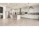 Spacious kitchen featuring an island, stainless steel appliances, and white cabinetry at 18346 W Coolidge St, Goodyear, AZ 85395